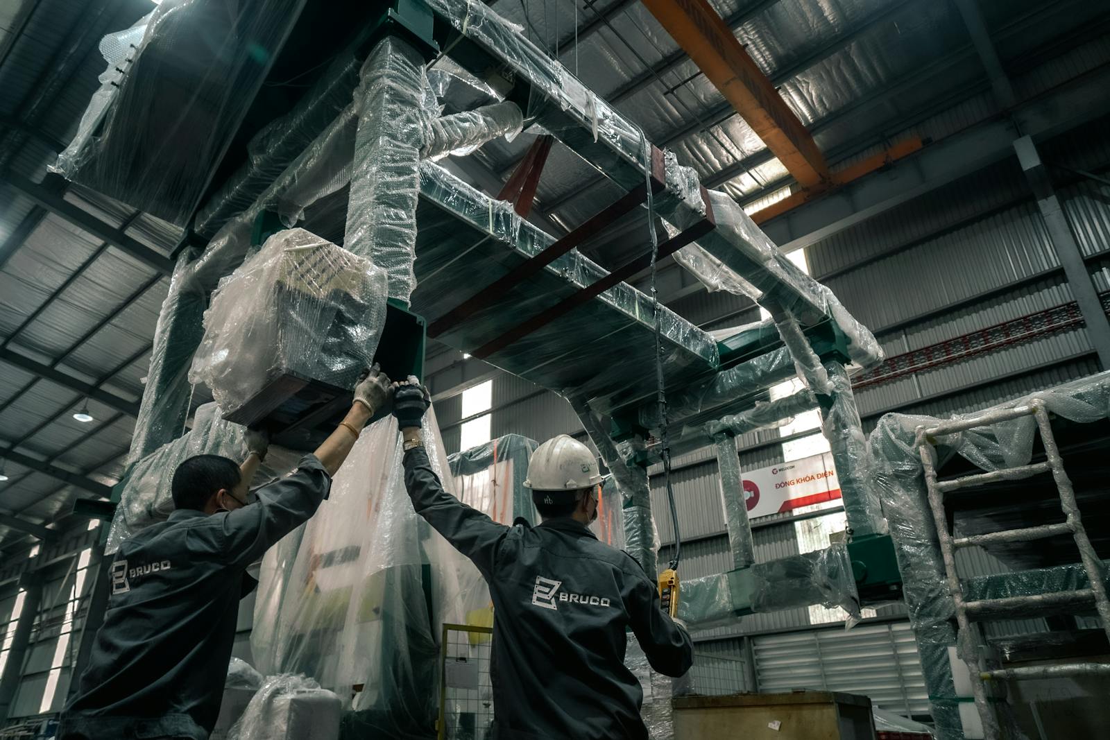 Industrial workers coordinating field operations inside a warehouse