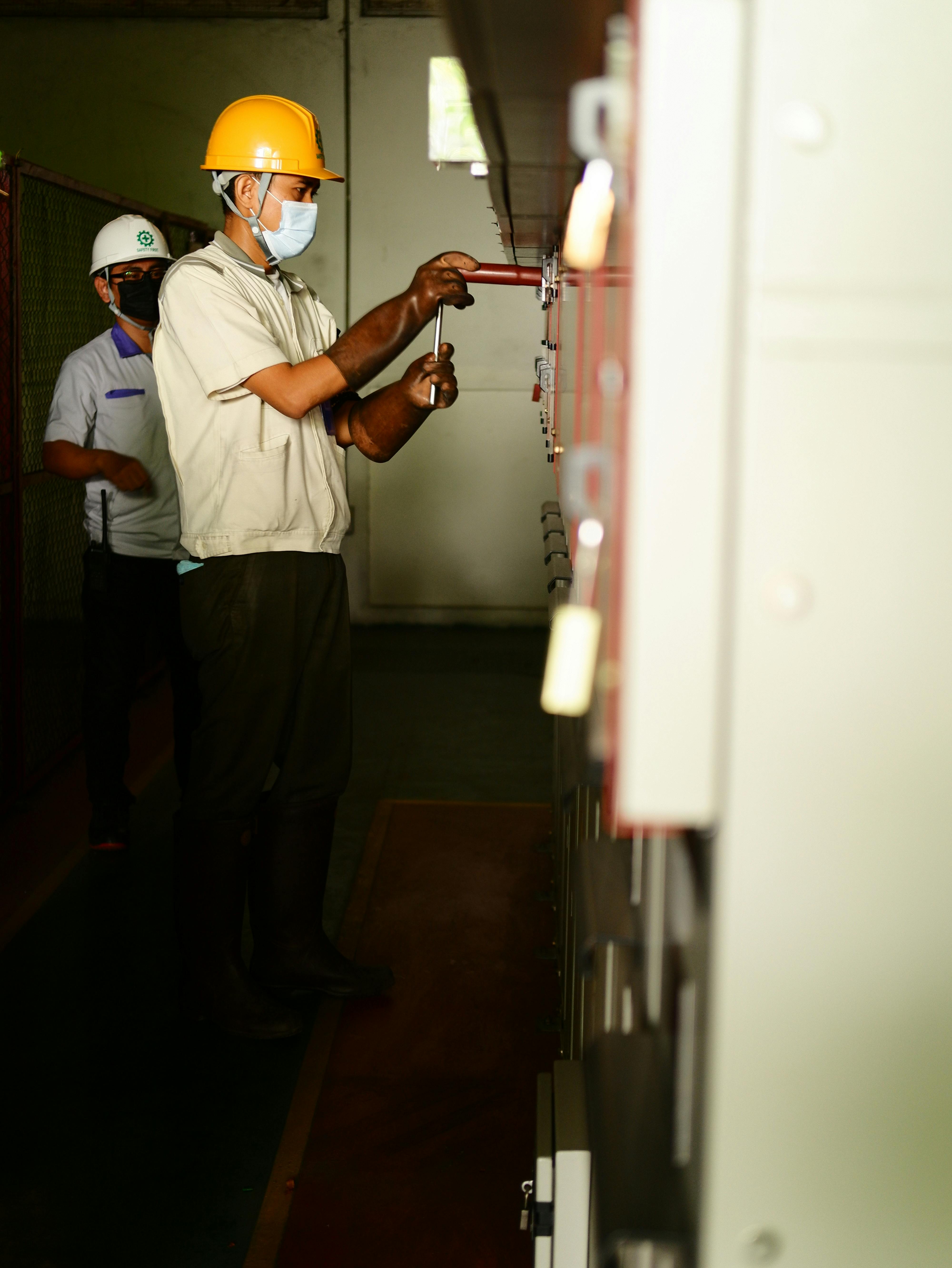 Field technician carrying out operational execution on industrial control equipment